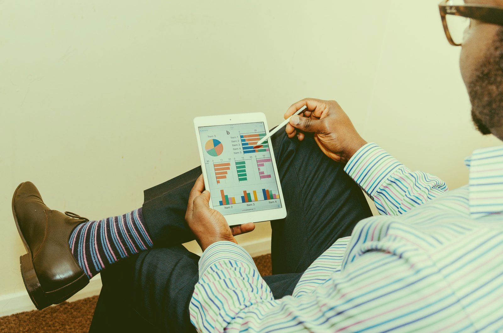 Person reviewing financial charts on a tablet